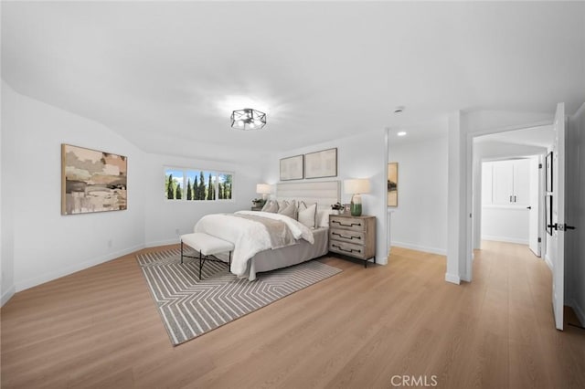 bedroom with recessed lighting, baseboards, and light wood-type flooring