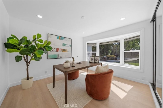 office area with recessed lighting, baseboards, and light wood-style flooring