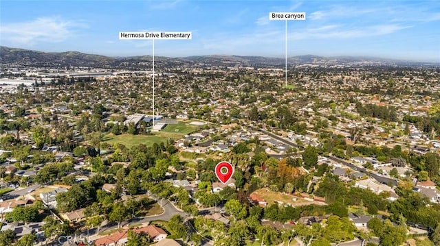 bird's eye view featuring a residential view and a mountain view