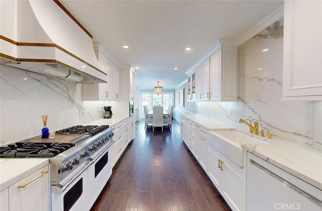 16143 Saint Croix Cir, Huntington Beach, CA 92649 - kitchen with custom range hood, white appliances, white cabinetry, recessed lighting, and decorative backsplash