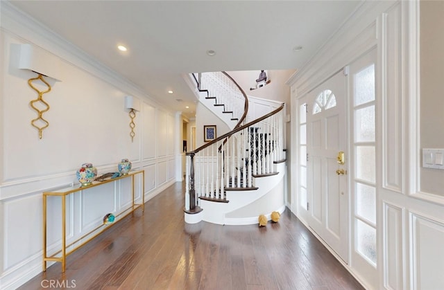 16143 Saint Croix Cir, Huntington Beach, CA 92649 - foyer featuring a decorative wall, stairway, wood finished floors, and ornamental molding