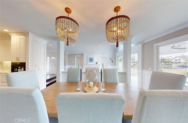 16143 Saint Croix Cir, Huntington Beach, CA 92649 - dining space featuring a chandelier, a decorative wall, a wainscoted wall, crown molding, and recessed lighting