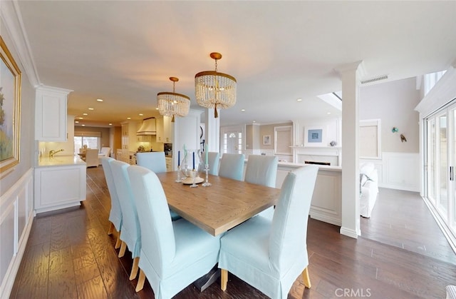 16143 Saint Croix Cir, Huntington Beach, CA 92649 - dining space featuring a decorative wall, dark wood-type flooring, a wainscoted wall, a chandelier, and recessed lighting