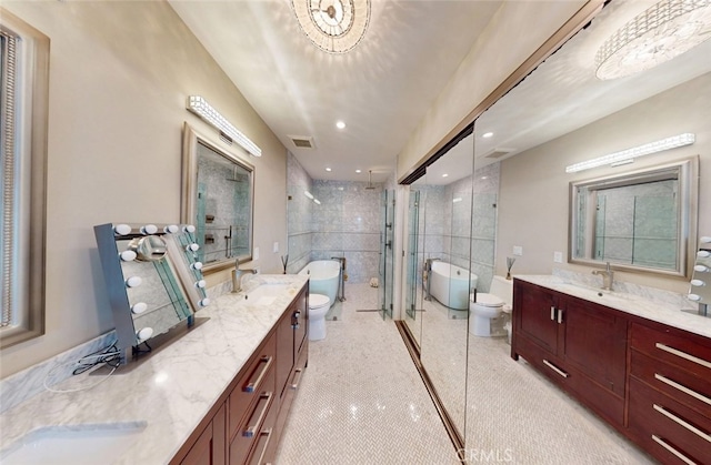16143 Saint Croix Cir, Huntington Beach, CA 92649 - bathroom with a shower stall, two vanities, a freestanding tub, and recessed lighting