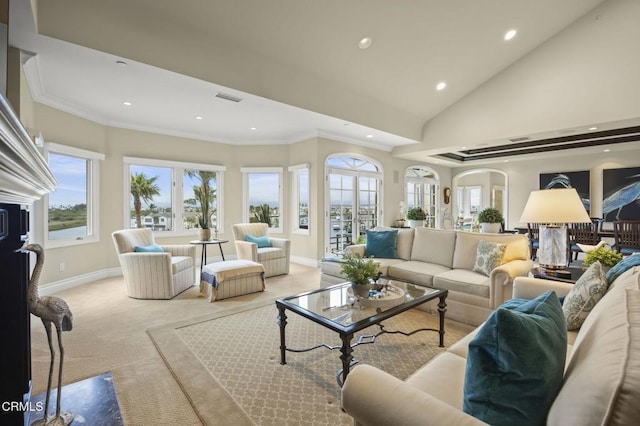living area featuring lofted ceiling, visible vents, recessed lighting, light carpet, and baseboards
