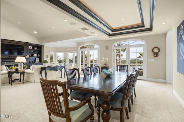 dining area featuring a tray ceiling, visible vents, light carpet, ornamental molding, and recessed lighting