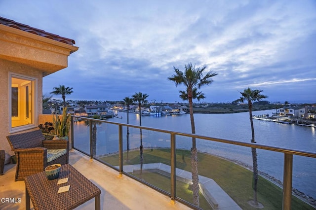 balcony featuring a water view