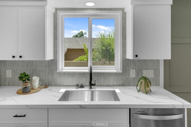 413 N Rimhurst Ave, Covina, CA 91724 - kitchen featuring white cabinets, decorative backsplash, a sink, and dishwasher