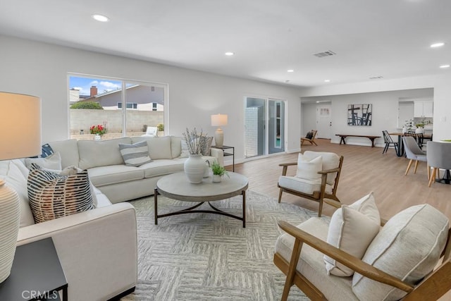 413 N Rimhurst Ave, Covina, CA 91724 - living room with recessed lighting, visible vents, and a healthy amount of sunlight