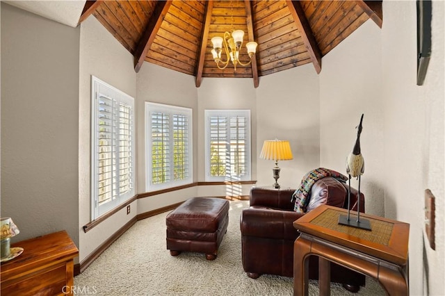 sitting room with an inviting chandelier, wooden ceiling, beamed ceiling, and carpet flooring