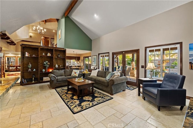 living room with stone tile floors, beamed ceiling, high vaulted ceiling, recessed lighting, and a notable chandelier