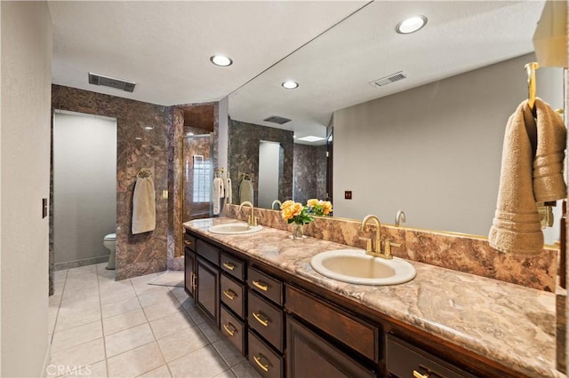 full bathroom featuring tile patterned flooring, a sink, double vanity, and toilet