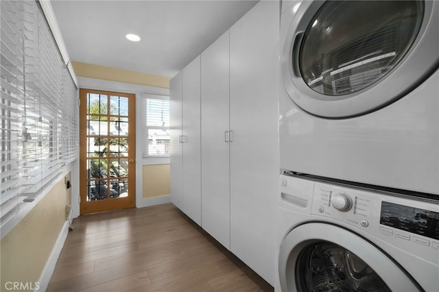 405 E Colton Ave, Redlands, CA 92374 - laundry area with stacked washer and dryer, cabinet space, baseboards, recessed lighting, and light wood-style flooring