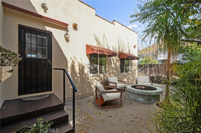 405 E Colton Ave, Redlands, CA 92374 - view of patio featuring an outdoor fire pit and fence