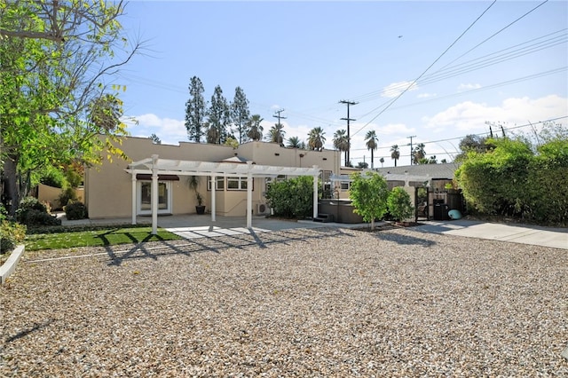 405 E Colton Ave, Redlands, CA 92374 - rear view of property with fence, a pergola, a patio, stucco siding, and a hot tub