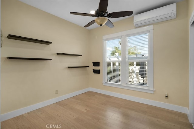 405 E Colton Ave, Redlands, CA 92374 - spare room with baseboards, ceiling fan, a wall mounted AC, and wood finished floors
