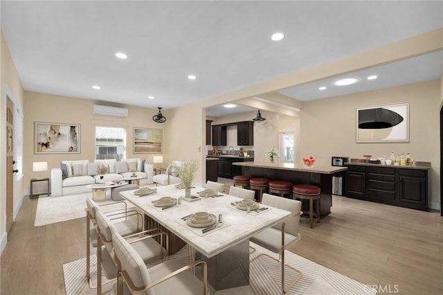 405 E Colton Ave, Redlands, CA 92374 - dining space featuring recessed lighting, light wood-style floors, and a wall mounted air conditioner
