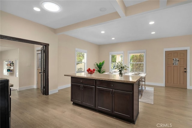 405 E Colton Ave, Redlands, CA 92374 - kitchen featuring baseboards, light wood finished floors, a healthy amount of sunlight, and dark brown cabinets