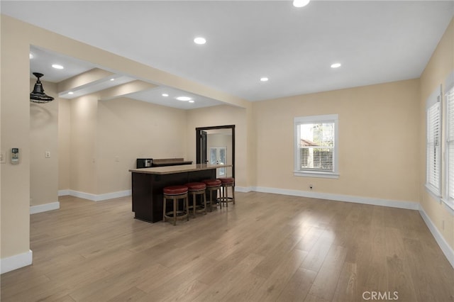 405 E Colton Ave, Redlands, CA 92374 - interior space with recessed lighting, baseboards, a bar, and light wood finished floors