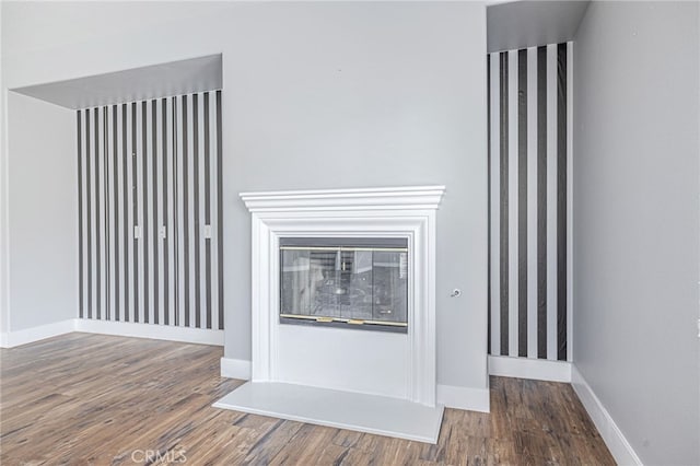 details with baseboards and wood finished floors