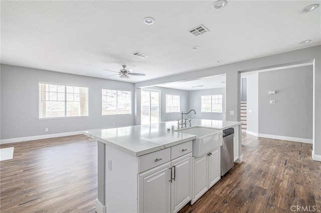 kitchen featuring a sink, open floor plan, and visible vents
