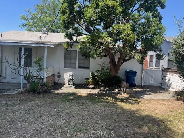 5548 Carley Ave, Whittier, CA 90601 - view of front of house with a gate, stucco siding, and fence
