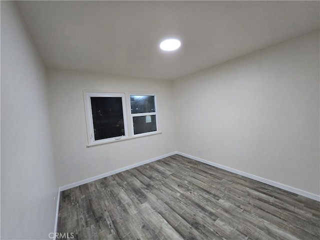 9412 Haney St, Pico Rivera, CA 90660 - unfurnished room featuring dark wood-style floors and baseboards