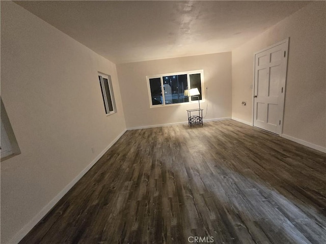 9412 Haney St, Pico Rivera, CA 90660 - unfurnished living room featuring dark wood finished floors and baseboards