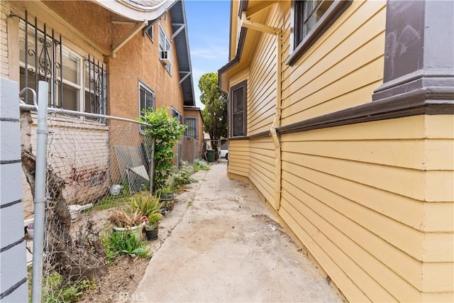 view of side of home with fence