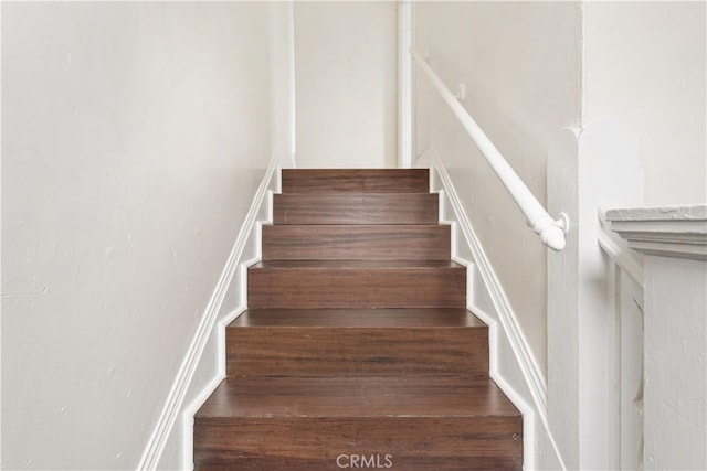 stairs with wood finished floors