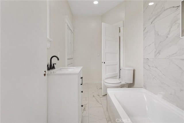 full bath featuring vanity, toilet, marble finish floor, a washtub, and baseboards