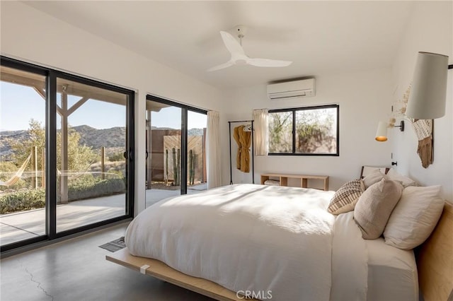 48575 Paradise Ave, Morongo Valley, CA 92256 - bedroom featuring an AC wall unit, access to outside, multiple windows, and a mountain view