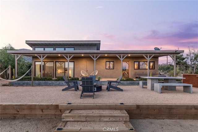 48575 Paradise Ave, Morongo Valley, CA 92256 - back of property featuring a patio area and stucco siding
