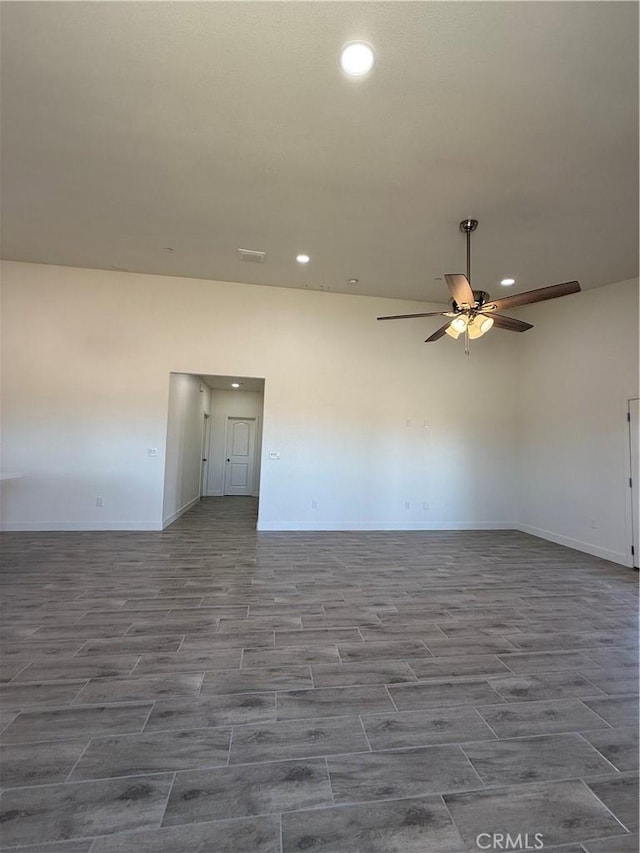 6472 Cayucos Dr, Phelan, CA 92371 - spare room with wood tiled floors, recessed lighting, a ceiling fan, and baseboards
