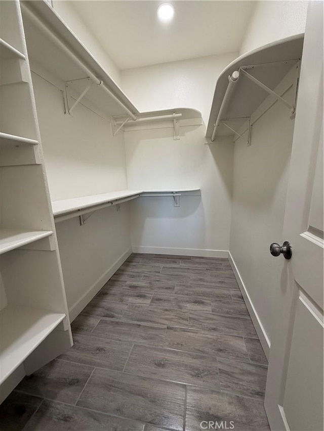 6472 Cayucos Dr, Phelan, CA 92371 - walk in closet featuring wood finished floors
