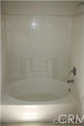full bathroom featuring washtub / shower combination
