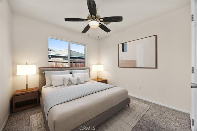 bedroom featuring baseboards, carpet flooring, and a ceiling fan