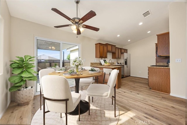 dining room with a ceiling fan, baseboards, recessed lighting, light wood-type flooring, and visible vents
