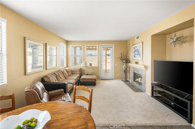 833 W Orange Heights Ln, Corona, CA 92882 - carpeted living room featuring a tile fireplace and baseboards