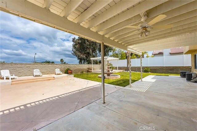 833 W Orange Heights Ln, Corona, CA 92882 - fenced backyard featuring a patio, a ceiling fan, and central AC unit