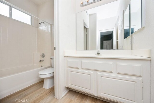 833 W Orange Heights Ln, Corona, CA 92882 - bathroom featuring toilet, wood finished floors, shower / washtub combination, and vanity
