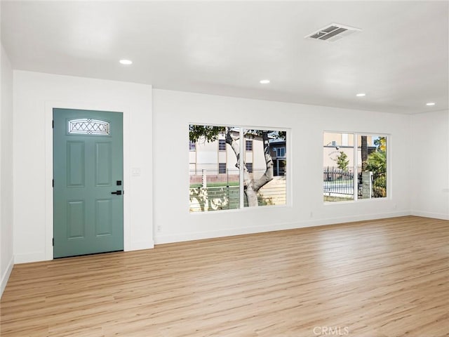 entrance foyer featuring visible vents, recessed lighting, light wood-style flooring, and a healthy amount of sunlight