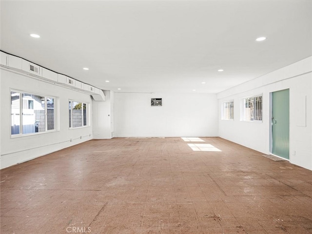 unfurnished room with recessed lighting and visible vents