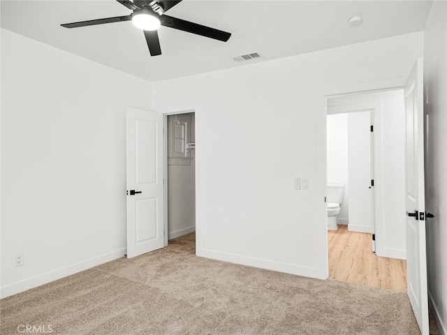 unfurnished bedroom with ceiling fan, carpet, baseboards, visible vents, and a closet