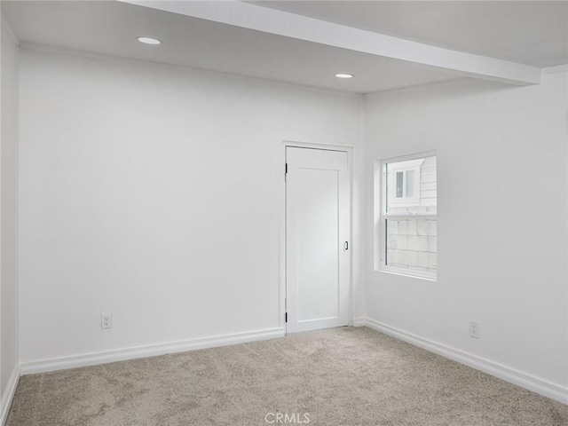 carpeted spare room with baseboards and recessed lighting