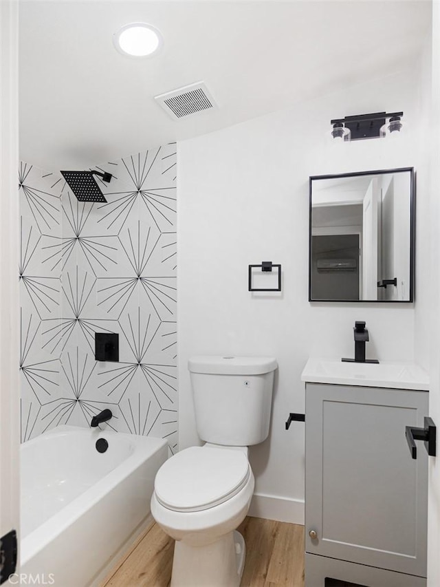 full bath with vanity, toilet, baseboards, wood finished floors, and visible vents