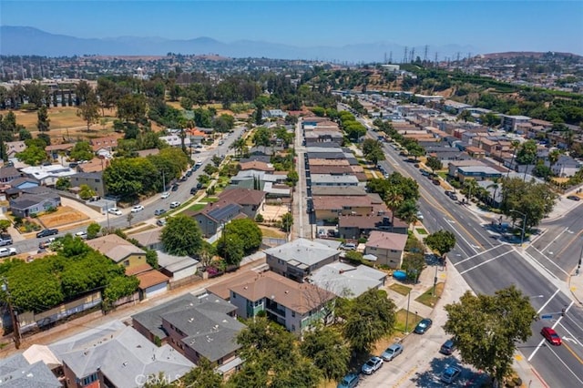 drone / aerial view featuring a mountain view and a residential view