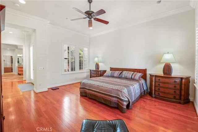 bedroom featuring baseboards, ornamental molding, ceiling fan, and hardwood / wood-style flooring