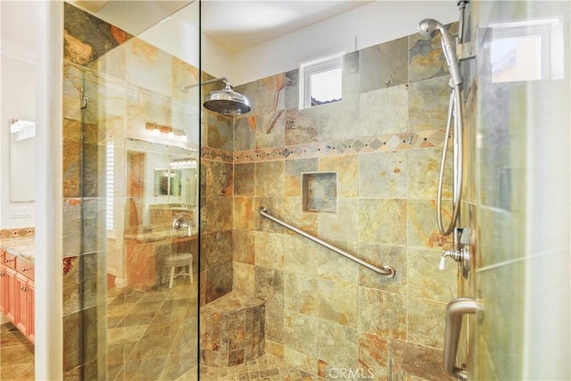 bathroom featuring vanity and a shower stall