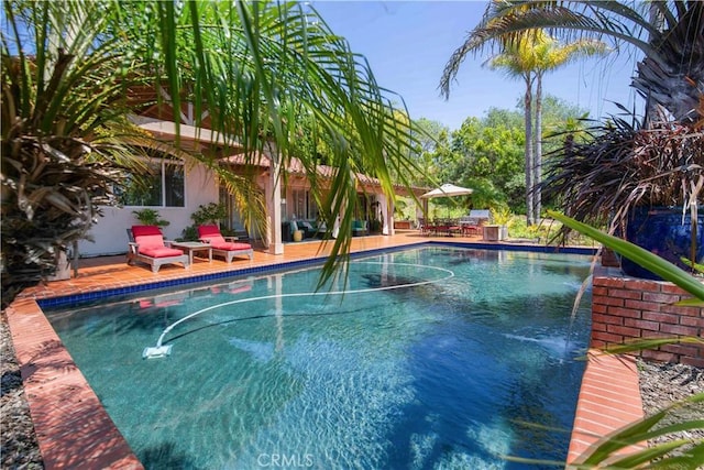 outdoor pool featuring a patio